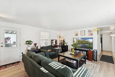 Living area featuring light wood-style flooring