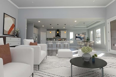 Living room featuring ornamental molding, recesse