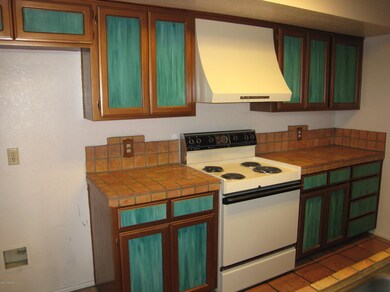 Kitchen w/ Tile Floor and Counters