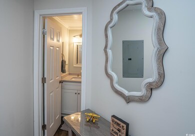 Corridor with sink and crown molding