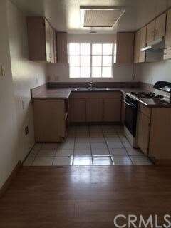 Kitchen has been upgraded with granite counters and looks onto the yard and patio area. Kitchen is small but works well for those family dinners.