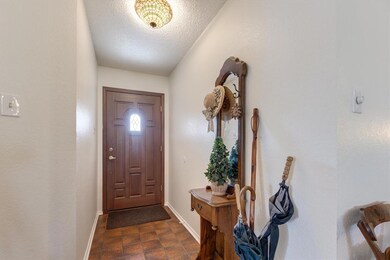 Front entry with elegant door allowing more light into the space.