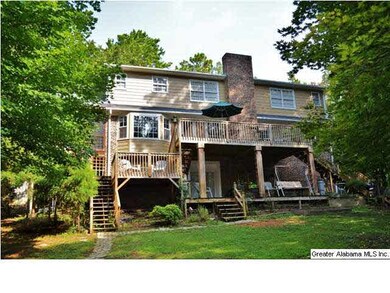 REAR ELEVATION SHOWING FULL BRICK FIREPLACE AND EX