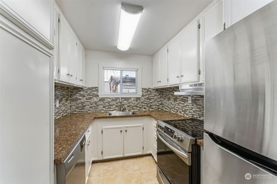 Your culinary dreams await you in this tidy kitchen just off the back deck by french doors.