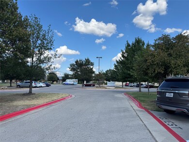 View of asphalt road with curbs