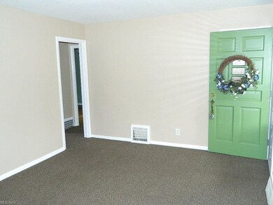 Front Living Room with Guest Closet, Window Treatm