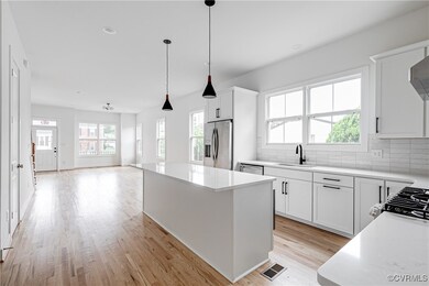 Kitchen featuring stainless steel appliances, ligh