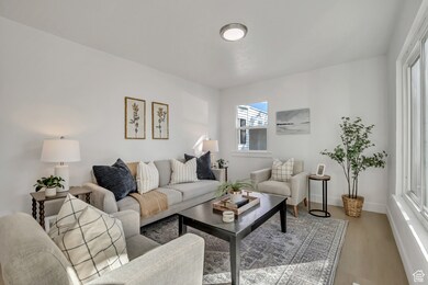 Living room featuring wood finished floors and baseboards