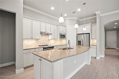 Kitchen with stainless steel appliances, a sink, a