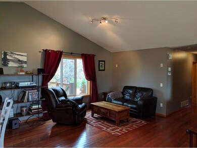 Vaulted living room is bright and big.