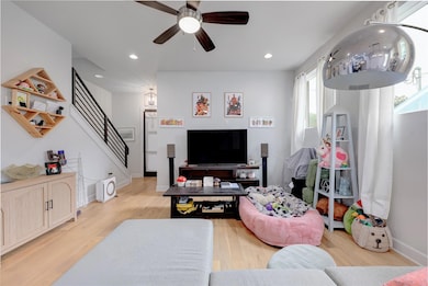 Living area featuring light wood-style flooring, 