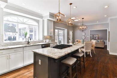 Custom kitchen with full overlay cabinets, walk in pantry, center island with downdraft cooktop, wall oven, microwave and new 48