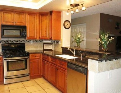 Remodeled Kitchen with New Cabinets and Granite Co