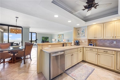 Kitchen with kitchen peninsula, ornamental molding