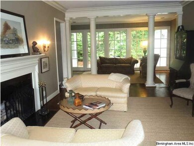 Large living room with beautiful fireplace.
