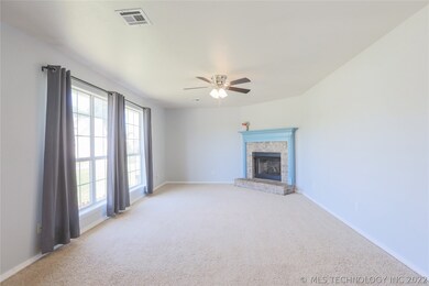 Large living area with farmhouse blue mantle.
