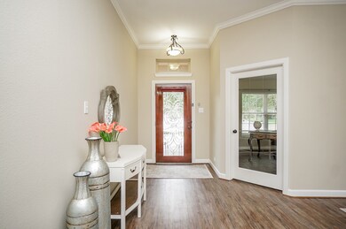 Step inside the foyer to be greeted by beautiful vinyl plank flooring, fresh paint, and high ceilings with thick crown molding. This home also features a whole house water softener and pre-wired alarm system for added peace of mind.