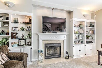 Large family room with wood burning fireplace, bui