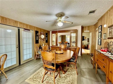 French doors out to enclosed lanai
