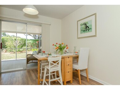 Dining area leading to rear screened porch and yar