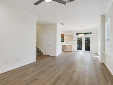 Unfurnished living room featuring light wood fini