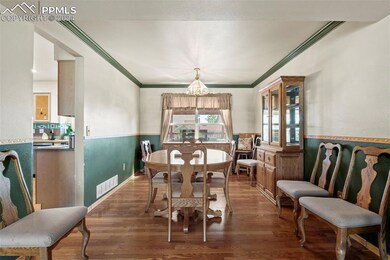Dining space featuring an inviting chandelier, cro