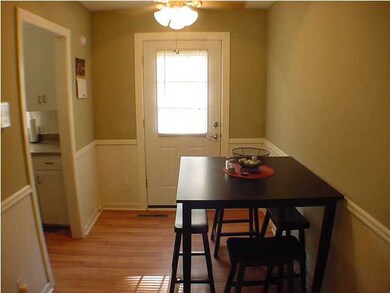 Dining room with wood laminate floors and a ceilin