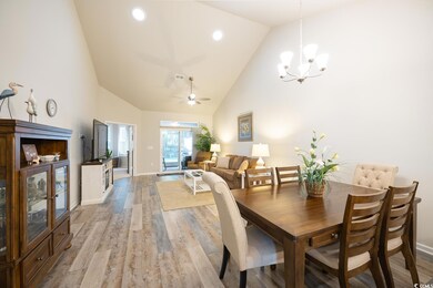 Dining room featuring ceiling fan with notable cha