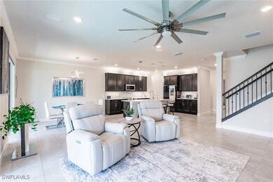 Living area with light tile patterned floors, stai