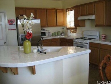 Apollo Way - Kitchen, island, white tile counters,