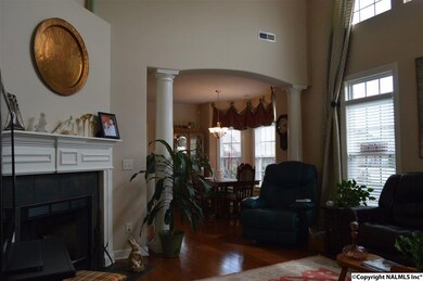 Gas fire place. Columns with arch to give separation to you dining.