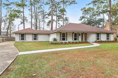 Fresh landscaping and long driveway