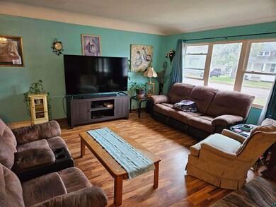 Living room with hardwood / wood-style floors