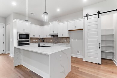 Kitchen with appliances with stainless steel fini