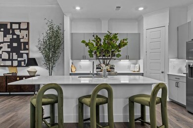 Kitchen with gray cabinets, light countertops, or