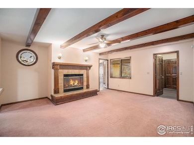 Head left through the entry to a cozy family room with fireplace