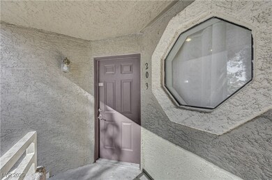 View of exterior entry featuring stucco siding