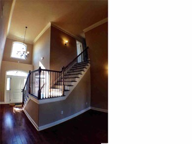 VIEW OF THE FOYER AND DECORATIVE STAIRCASE!