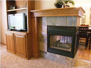 The living room side of the 3 way gas fireplace an