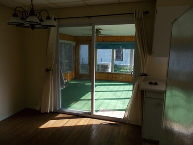 New sliding doors connect dining area to three sea