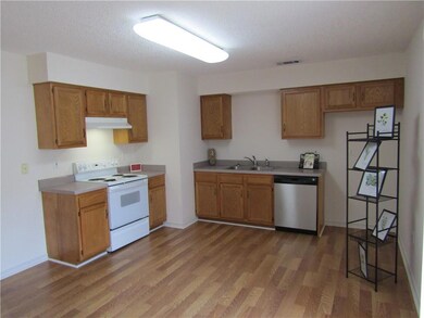Spacious kitchen, with door on right that leads to