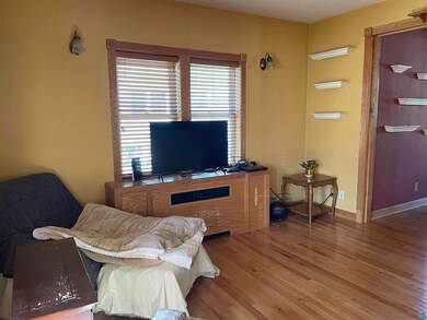 Living room featuring hardwood / wood-style floori