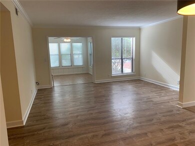 View from dining area to living room and sunroom