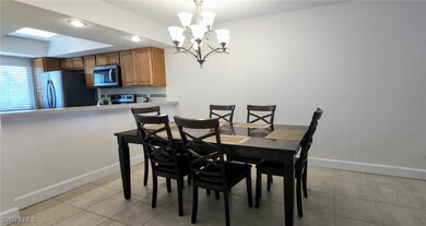Dining area featuring an inviting chandelier and b