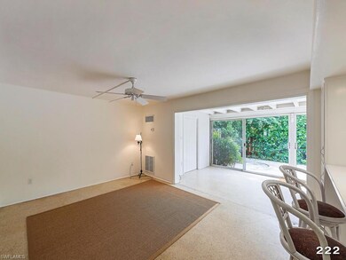 Living room looking out to Florida Room and Patio