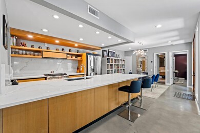 Kitchen with a sink, visible vents, recessed ligh