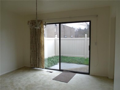 Spacious family room with glass sliders leading to