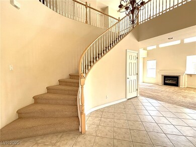 Staircase with tile patterned floors, a towering c