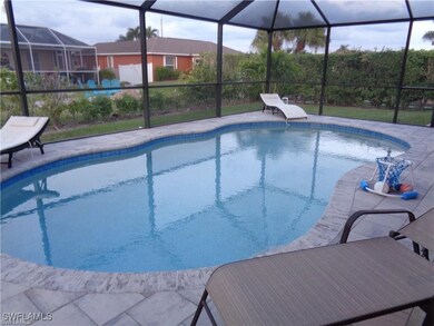 Outdoor pool with glass enclosure and a patio area