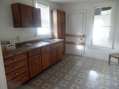 Kitchen. Upper unit kitchen. Nice oak cabinets.